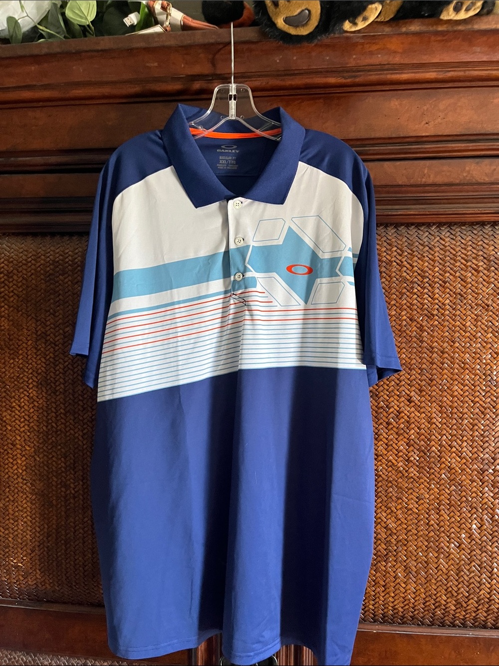 Oakley Blue Polo with Light Blue, White and Orange Graphic
